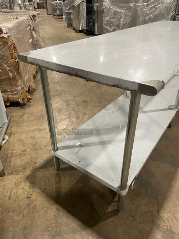 L&J stainless steel worktop table with undershelf; new, scratch-and-dent condition, on sturdy legs.