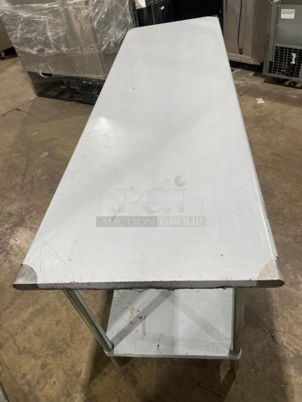 L&J Stainless Steel Worktop Table, single undershelf, scratch-n-dent condition, on legs, visible scuffs and dents.