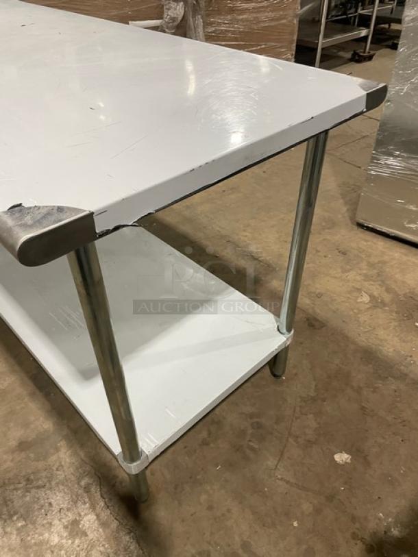L&J Commercial stainless steel worktop table with undershelf, new condition, minor scratches and dents, sturdy legs.