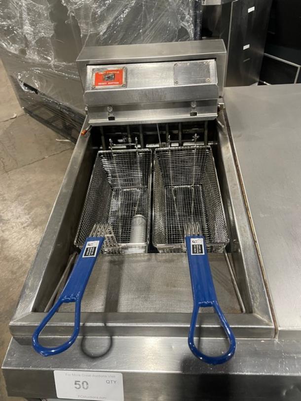 Pitco Frialator Series 2-Bay Commercial Stainless Steel Deep Fryer with enclosed pan cabinet, basket hanger, and fry baskets on casters.