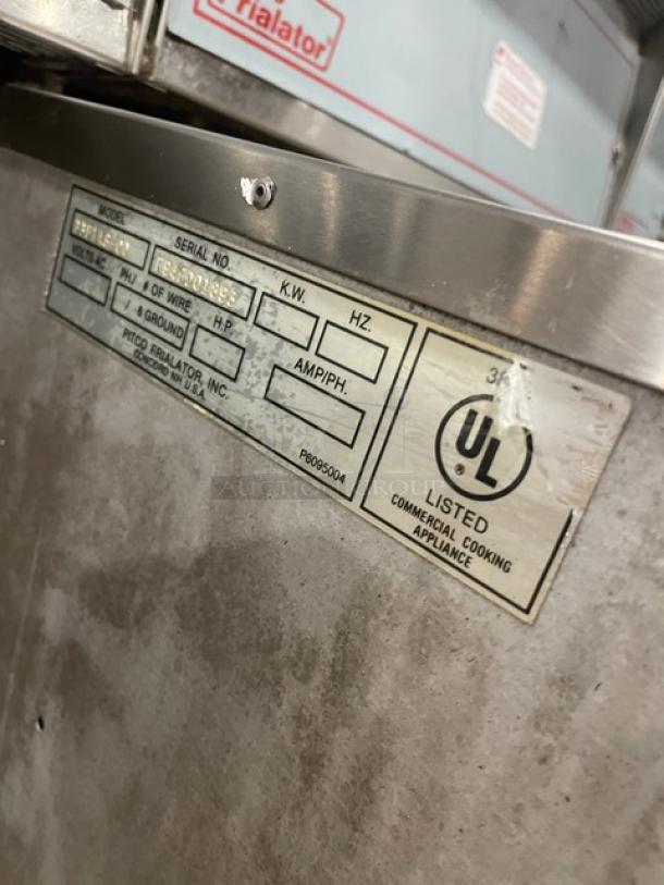 Pitco Frialator Series 2-bay fryer with enclosed pan cabinet, backsplash, basket hanger; UL listed label visible.