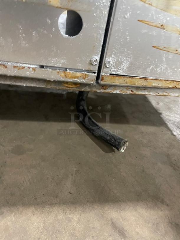 Pitco Frialator stainless steel 2-bay deep fat fryer with center cabinet, backsplash, basket hanger, on casters, moderate wear.