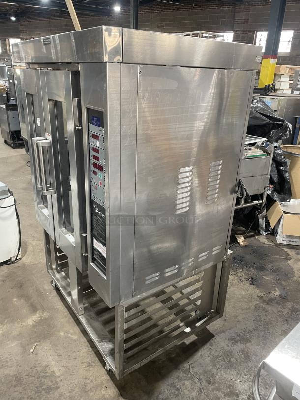 Baxter OV300G stainless steel convection oven with digital controls, 8-pan rotating rack, open-base stand, on casters, auctioned item.