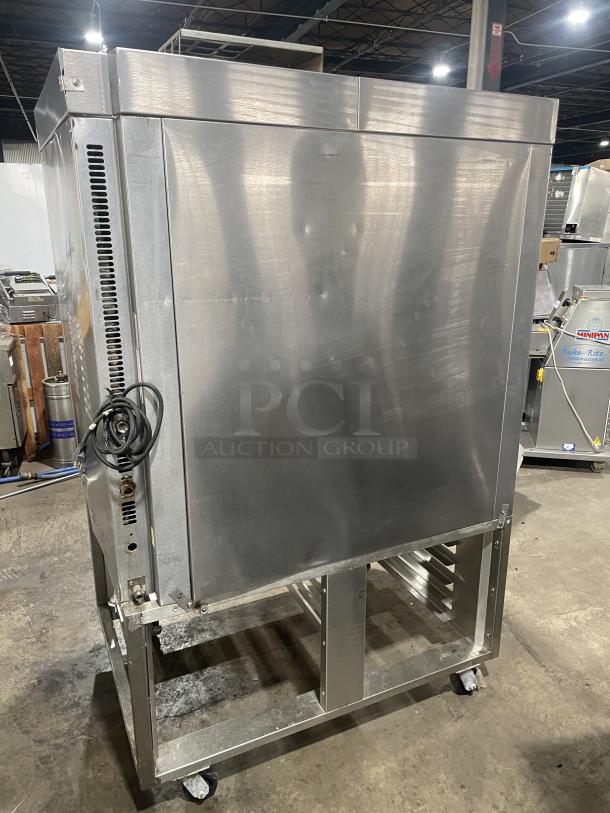 Baxter OV300G stainless steel convection oven with digital control, 8-pan rotating rack, gas-powered, on casters, good condition.
