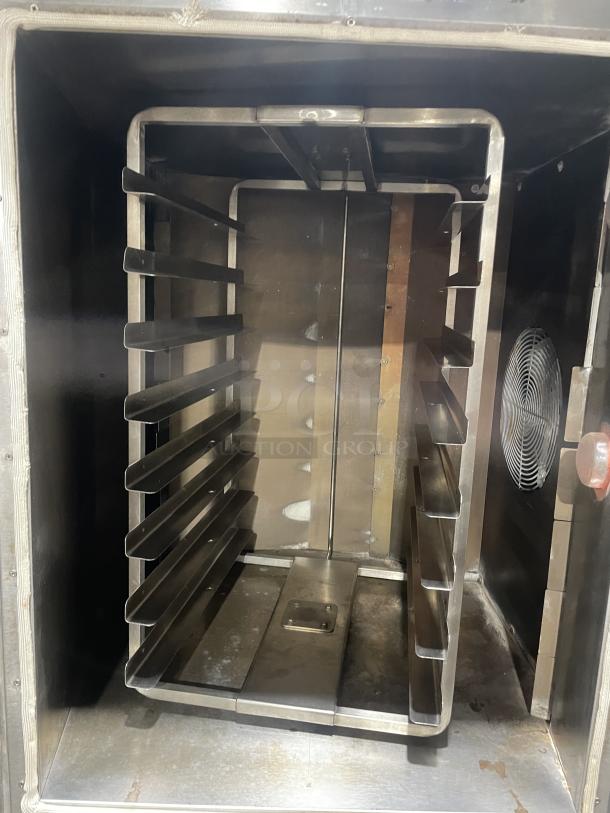 Baxter OV300G stainless steel convection oven, natural gas, with digital control, interior 8-pan rotating rack, on casters.