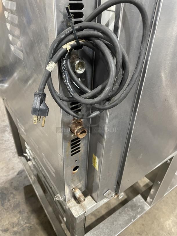 Baxter OV300G stainless steel convection oven on cart, showing gas connection and wiring, in good used condition.