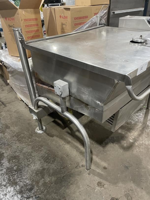 Groen stainless steel 40-gallon gas-powered tilted braising pan on legs, used, with minor surface wear.