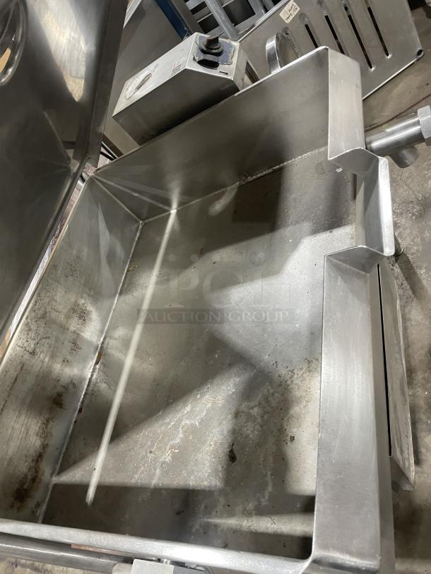 Groen commercial 40-gal stainless steel gas-powered tilted braising pan, on legs, minor wear, control panel visible.