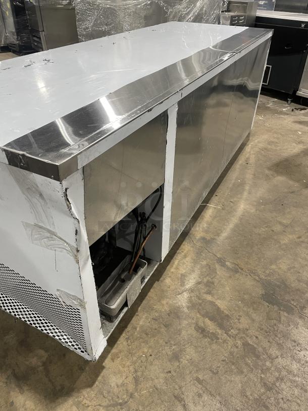 Custom Cool stainless steel 3-door refrigerated 93" worktop table, model LB93SC, like new, with built-in pan rack, on casters.