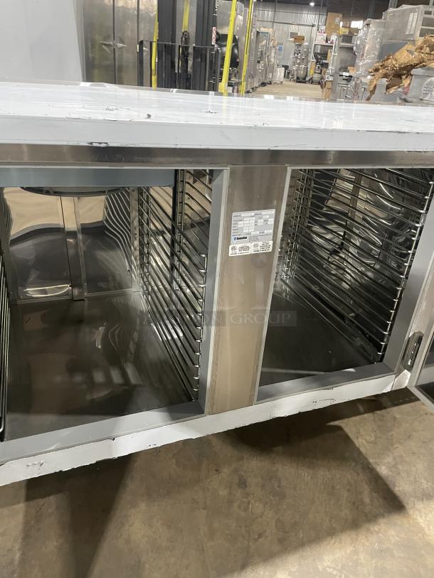 Custom Cool 3-Door Stainless Steel Refrigerated Worktop Table, Model LB93SC, like new, 93", built-in pan rack, on casters.