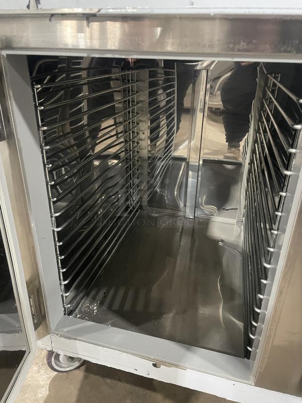 Custom Cool 3-door stainless steel refrigerated worktop table, Model LB93SC, like new, with built-in pan rack, on casters.
