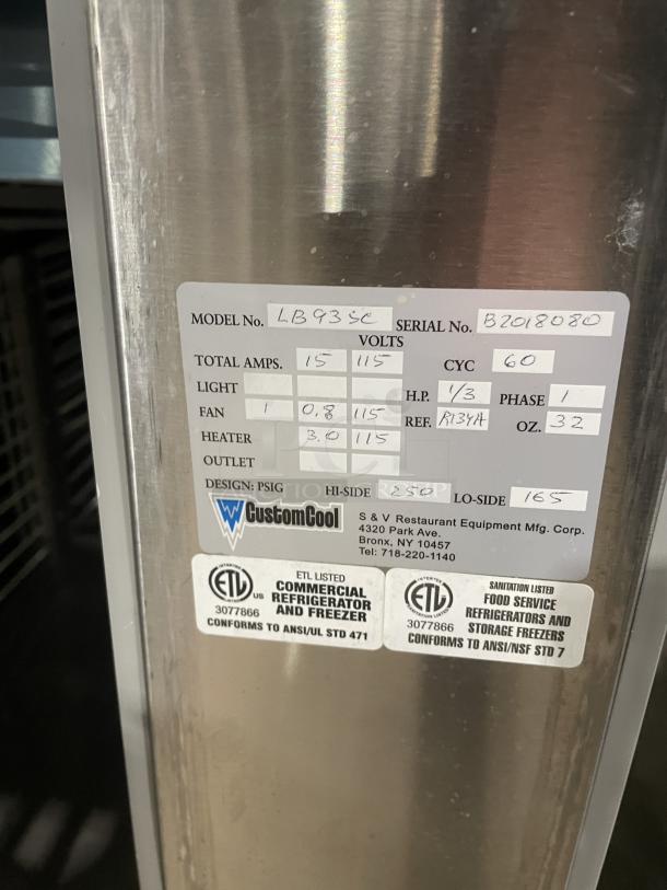 Custom Cool LB93SC stainless steel 3-door refrigerated worktop table, like new, model: LB93SC, SN: B2018080, on casters.