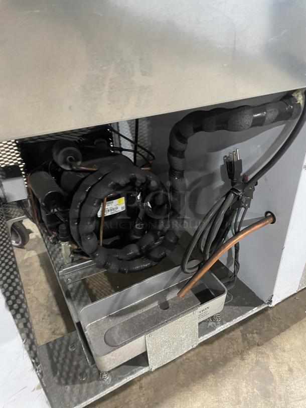 Custom Cool 3-door stainless steel refrigerated worktop, model LB93SC. Like new, with pan rack, on casters. Serial: B2018080.