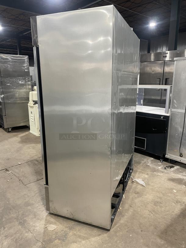 True T-Series stainless steel double glass door merchandiser refrigerator, model T-49G, with poly-coated wire rack.