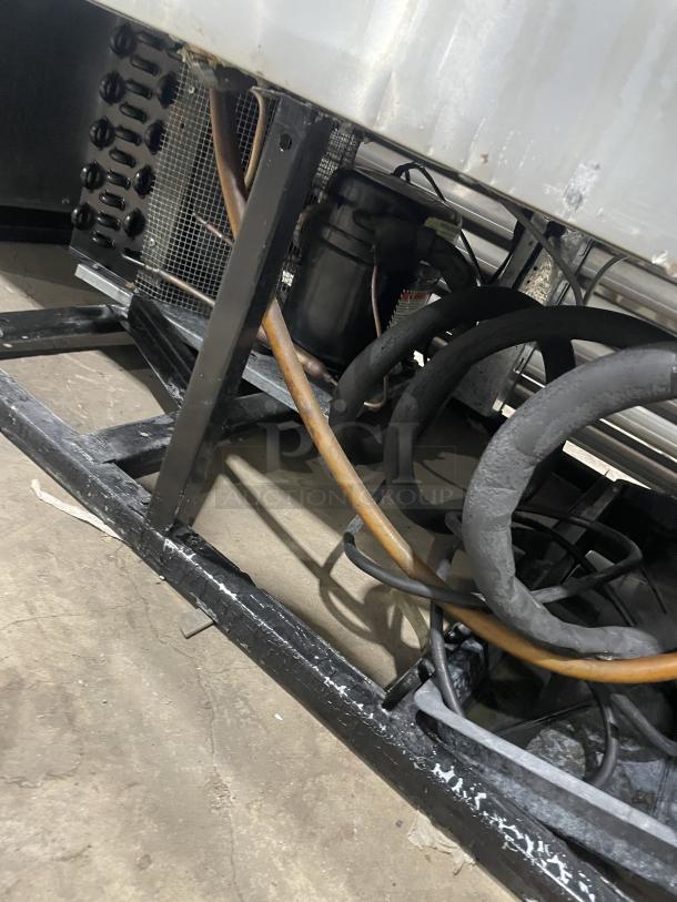 True T-Series Commercial Refrigerator, Model T49G, stainless steel, dual glass doors, poly coated wired rack, 115V 1 Phase.