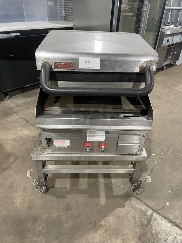 Lang commercial stainless steel infrared clamshell griddle, model 224THNATMG, on casters with equipment stand. Natural gas powered.