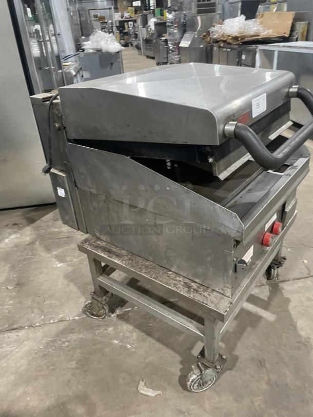 Lang stainless steel natural gas countertop infrared clamshell griddle, Model 224TH-NATMG, with cart, on casters, used condition.