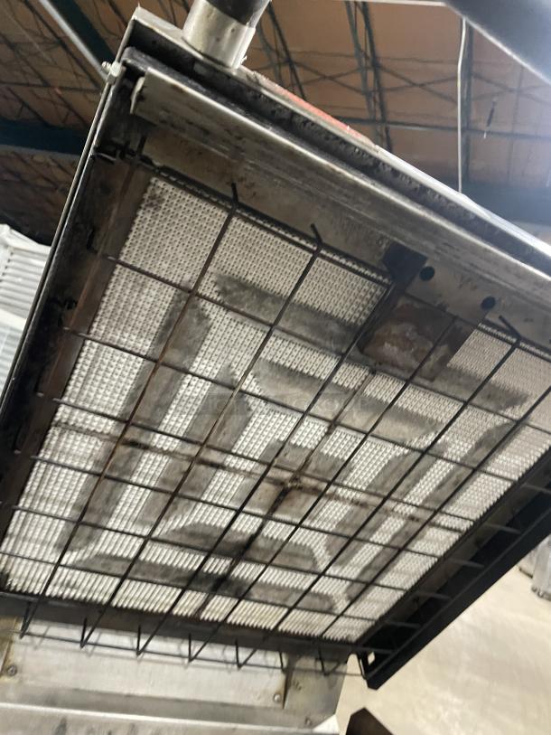 Lang 224TH-NATMG commercial stainless steel infrared clamshell griddle on casters, well-used condition, with equipment stand.