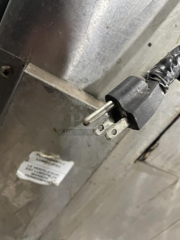 Lang commercial stainless steel infrared clamshell griddle, model 224TH-NATMG, with equipment stand and casters. Plug detail shown.