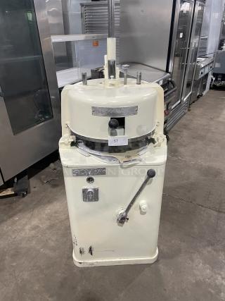 Rompa white electric dough rounder/divider, free-standing, with rounding plate, in working condition. Visible wear on surface.