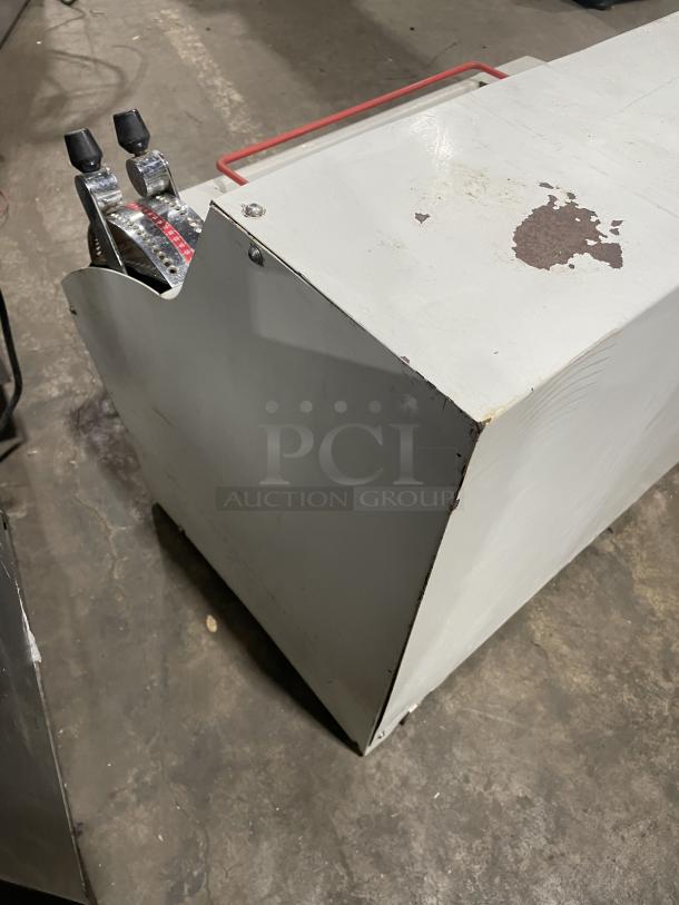 Merand Tenor 2 countertop dough moulder in white. Features lever controls. Condition shows wear; electric, 220V.