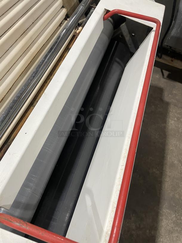 Merand Tenor 2 electric countertop dough moulder, white, vertical design, 220V, working condition, visible red safety bars.