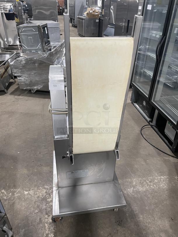 Minipan MGX stainless steel dough sheeter, electric-powered, with conveyor and casters, 220V 3-phase, good condition.