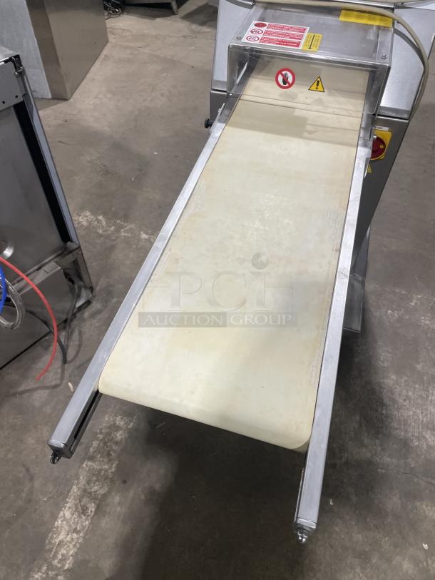 Minipan MGX dough sheeter, stainless steel, electric, floor model with conveyor, 220V 3 phase, on casters, good condition.