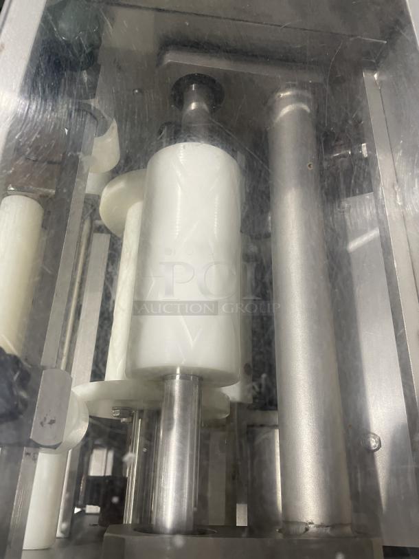 Minipan MGX commercial dough sheeter, stainless steel, electric, with conveyor and casters, 220V 3-phase, used condition.