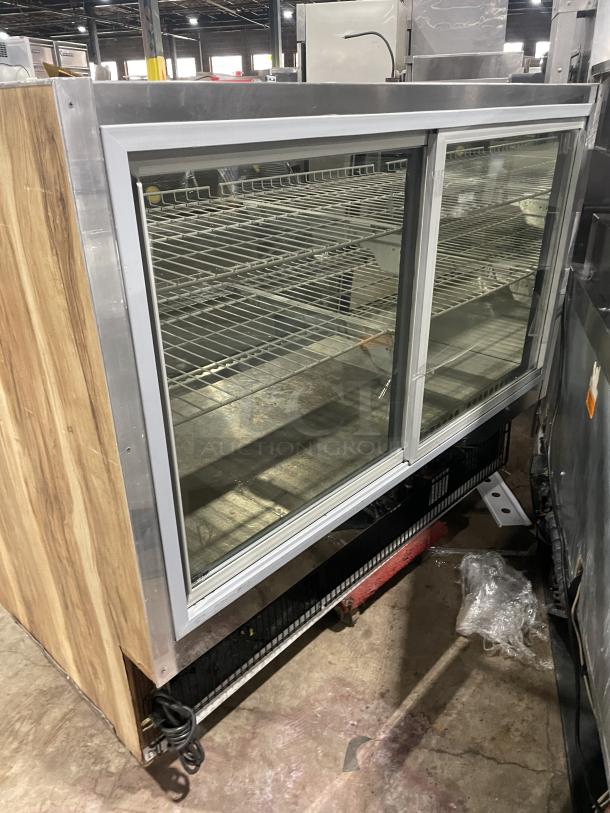 Marc SQBCR-59 59" refrigerated bakery display case with wooden finish, flat glass tiers, and wired rack; rear sliding doors.