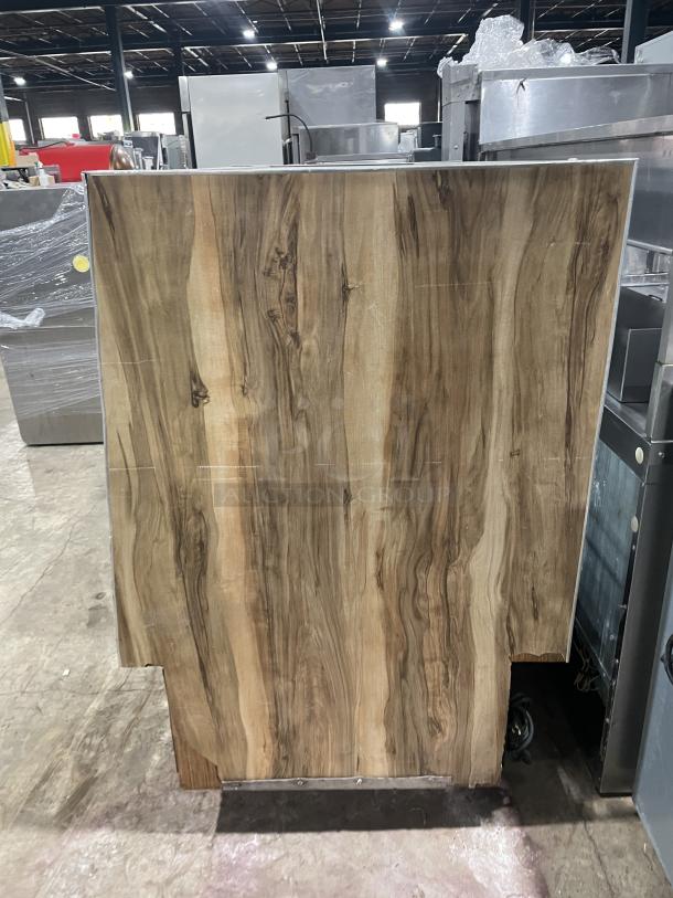 Marc Model SQBCR59 59" wooden style refrigerated bakery display case with rear sliding glass doors and poly coated wired rack.