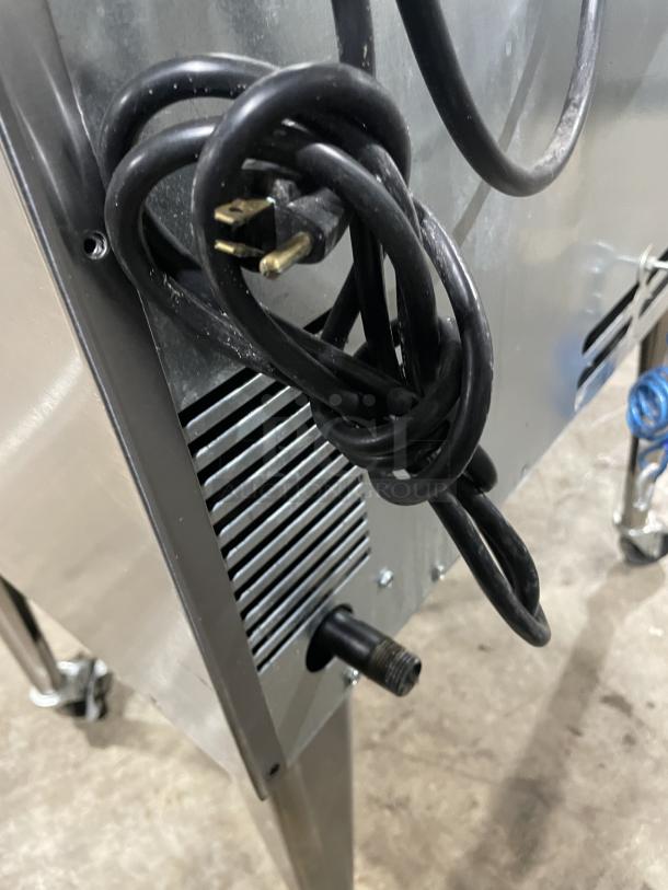 Imperial PCVG-1 stainless steel gas convection oven rear view with power cord and gas connector, on casters.