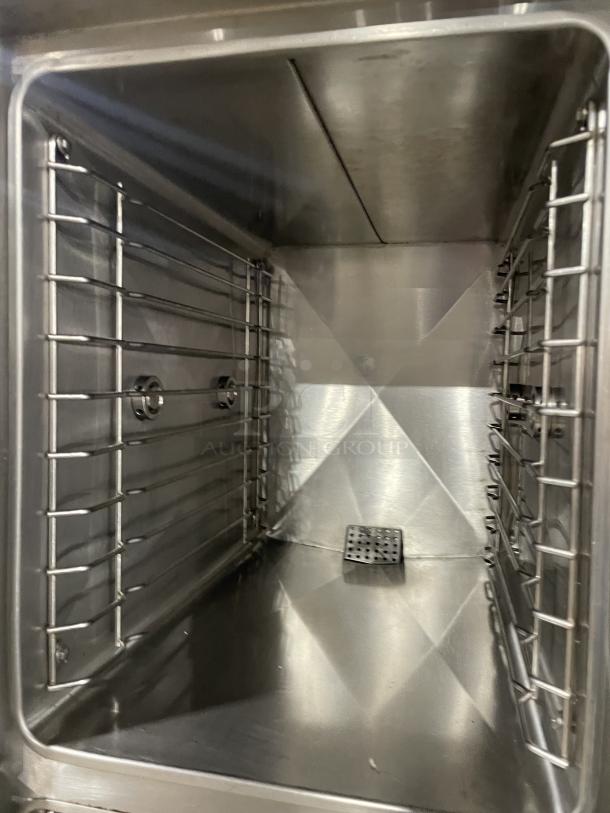 Crown GSX10HE dual compartment convection steamer interior; stainless steel, universal pan racks, pristine condition.