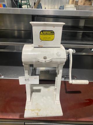 Weston Commercial White Cast Aluminum Manual Meat Cuber/Tenderizer with crank bar, countertop model, visible safety label.