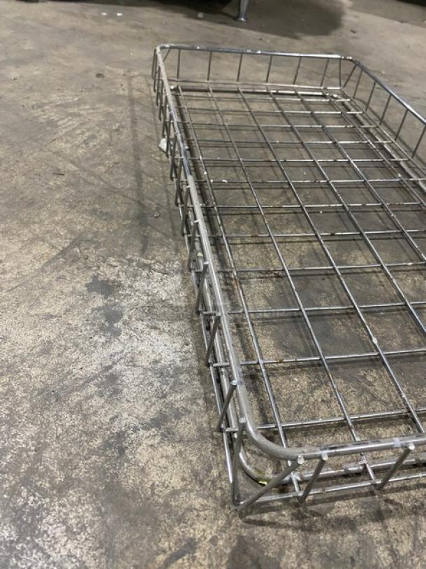 Commercial metal wired food serving tray in good condition, rectangular shape, ideal for catering or food service.