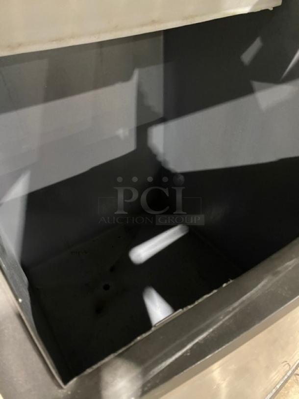 Manitowoc Indigo NXT Series ice machine bin interior, clean condition. Model: IY1106A261. Energy Star certified.