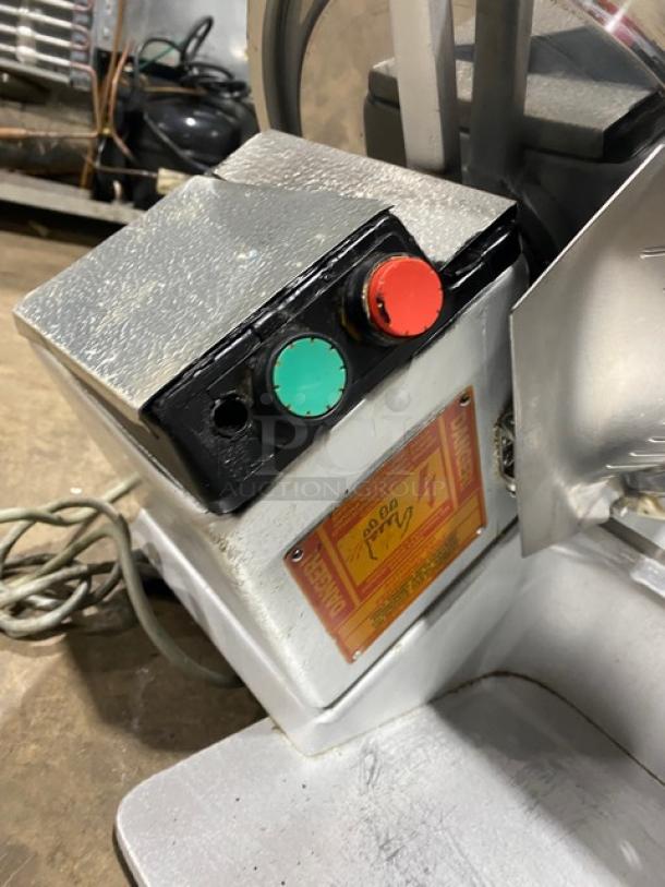 Bizerba commercial stainless steel electric meat slicer, model SN: 22-12929, with 120V power, control buttons, and visible wiring.