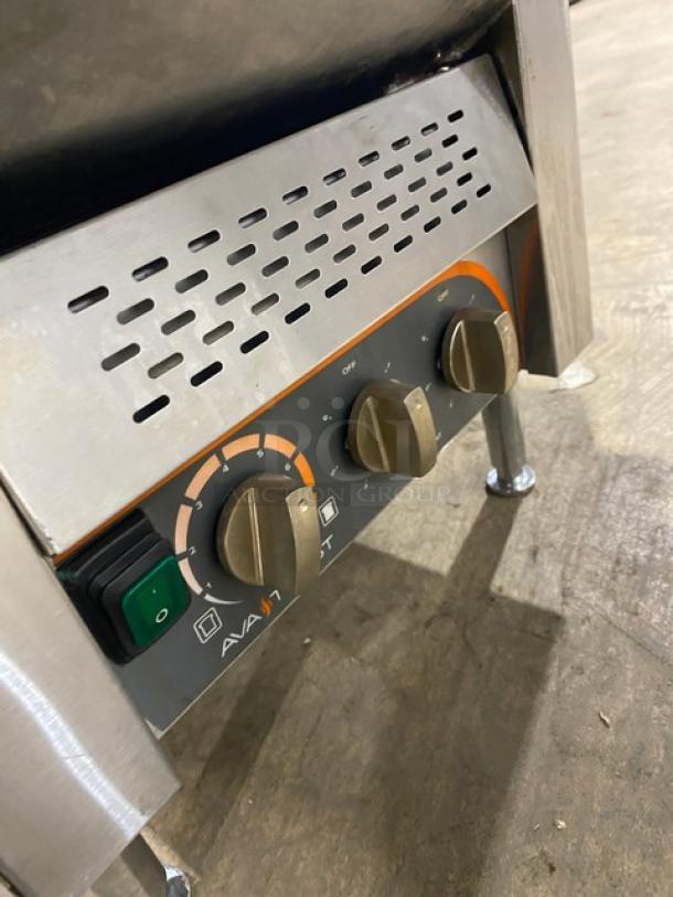 Ava Toast TT300208 stainless steel conveyor toaster, 208V, with control knobs, ventilation panel, and sturdy legs.
