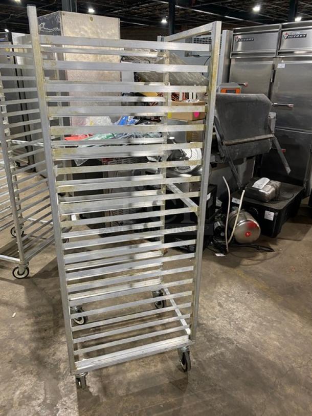 Commercial aluminum bun/sheet pan rack with casters, heavy-duty design, multiple shelves, moderate wear, ideal for kitchens.