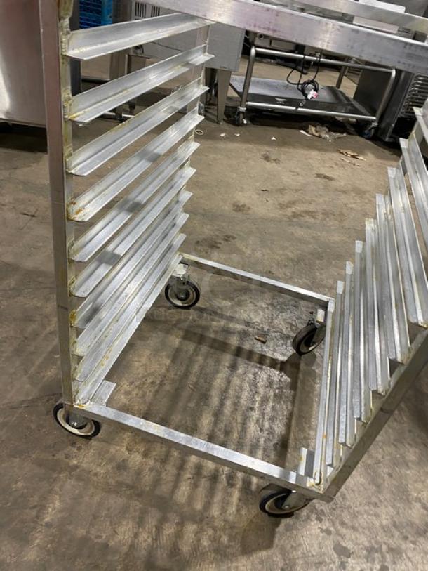 Heavy-duty aluminum bun/sheet pan rack on casters, sturdy frame, multiple slots, ideal for commercial kitchens.