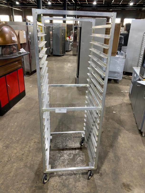 Commercial aluminum heavy-duty bun/sheet pan rack on casters, 20-tier, sturdy metal frame, good condition, ideal for bakeries.