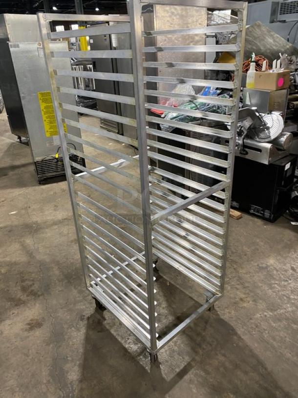Commercial aluminum heavy-duty bun/sheet pan rack on casters, multiple shelf levels, used condition, ideal for bakery use.