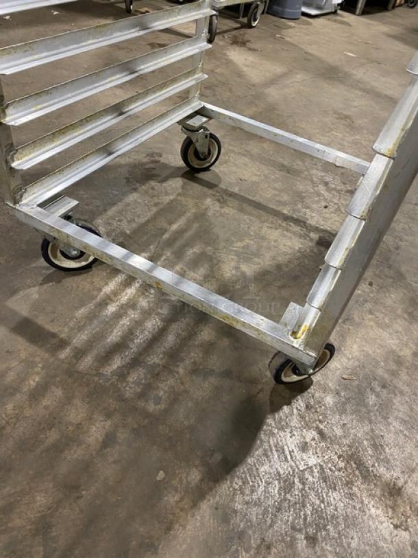 Commercial aluminum bun/sheet pan rack with multiple shelves and caster wheels. Heavy-duty and durable condition.