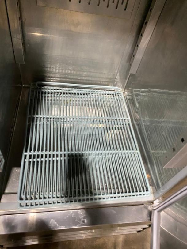 Avantco stainless steel single solid door reach-in freezer, model 178SS1RHC, with poly-coated wire rack, clean interior.