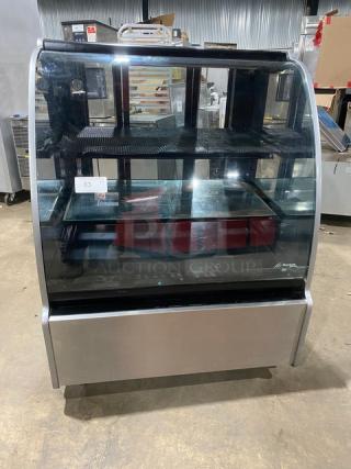 Structural Concepts Encore Series refrigerated bakery display case, model HV38R. Stainless steel, curved glass, glass shelving, 120V, 1 Phase.
