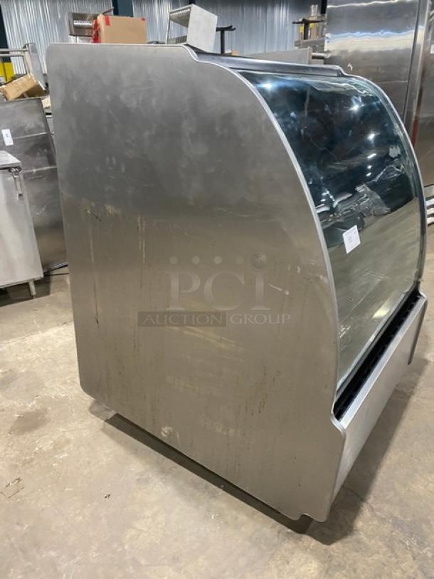 Structural Concepts Encore Series HV38R commercial refrigerated bakery display case, stainless steel, curved glass, used condition.
