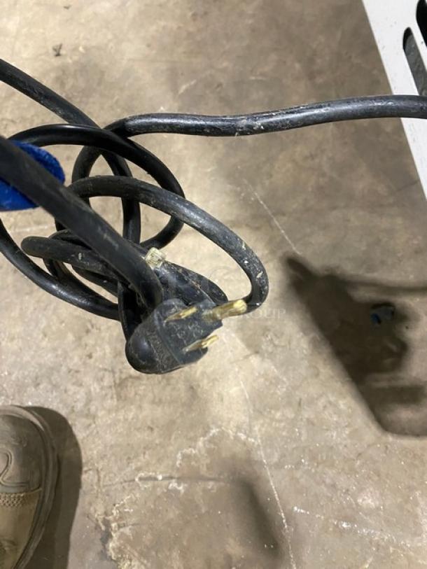 Close-up of a black electrical power cord for the Structural Concepts Encore Series display case, model HV38R.