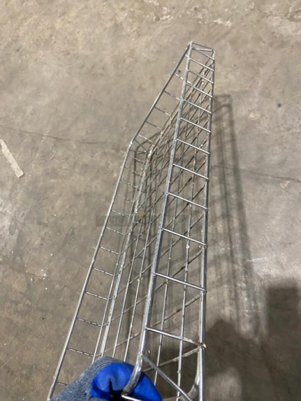 Commercial full-size chrome-plated bagel/pastry wire rack, new condition, sturdy metal construction, ideal for display.