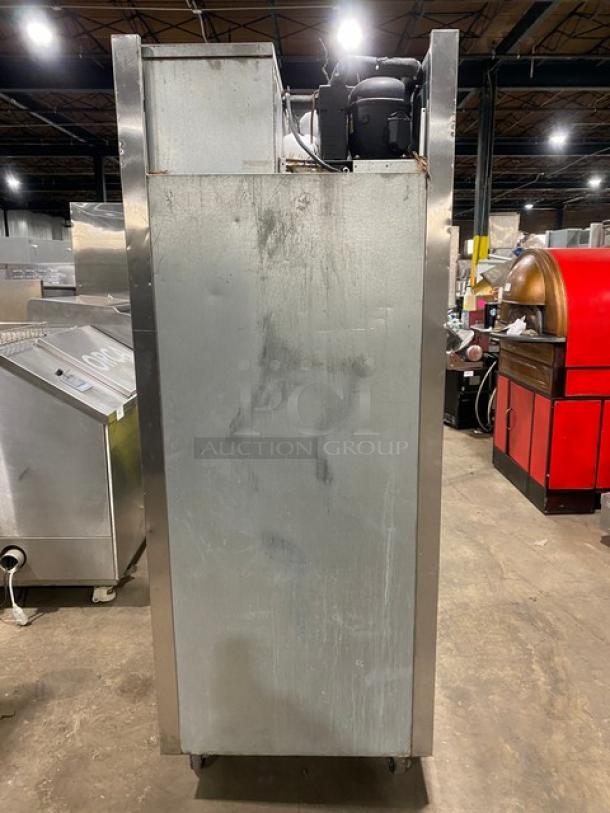 Traulsen commercial stainless steel refrigerator, Model RET132EUT-FHS, single door, adjustable shelving, on casters.