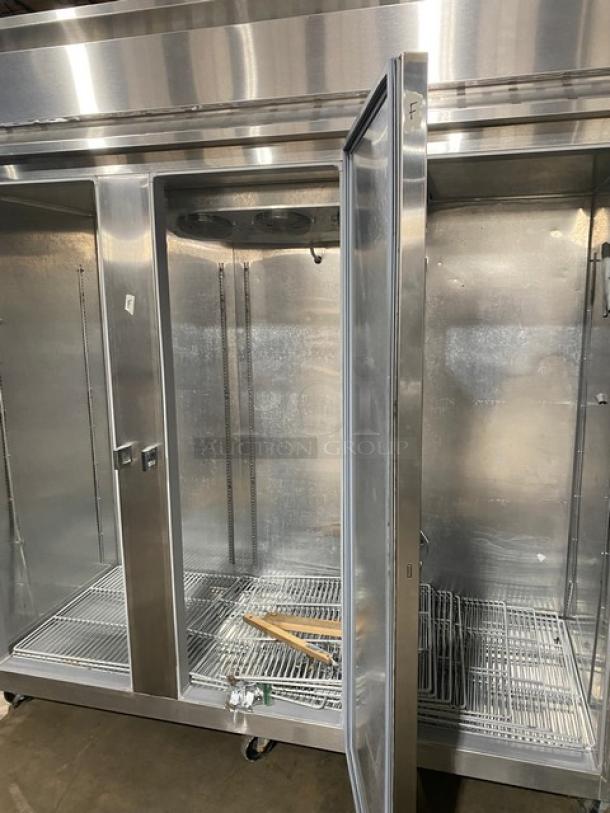 Continental 3F stainless steel 3-door reach-in freezer, Energy Star certified, poly-coated wire racks, on casters, used.